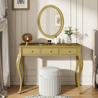 Gold vanity table with round mirror, drawers, and decorative items in a room setting.