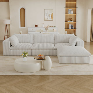 Modern living room with a white sectional sofa, coffee table, and decorative elements.