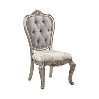 Decorative chair with silver frame and tufted gray backrest on a white background