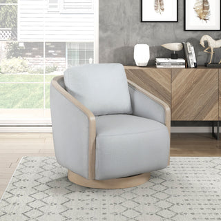 Gray armchair in a living room setting with a wooden sideboard and decorative items.